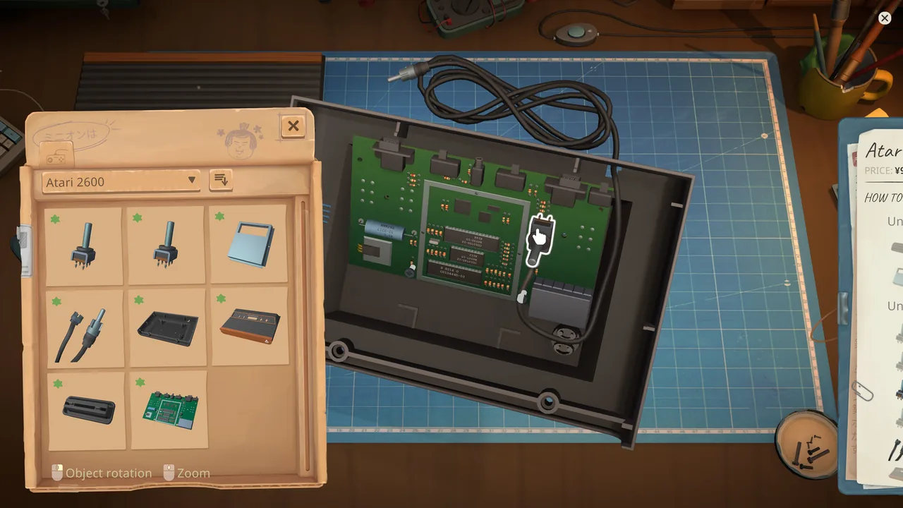 Opened Atari 2600 console with its motherboard, cables, and parts tray visible