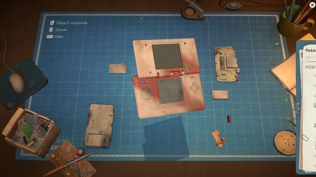 Opened handheld game device with separated casing, board, battery, and screws
